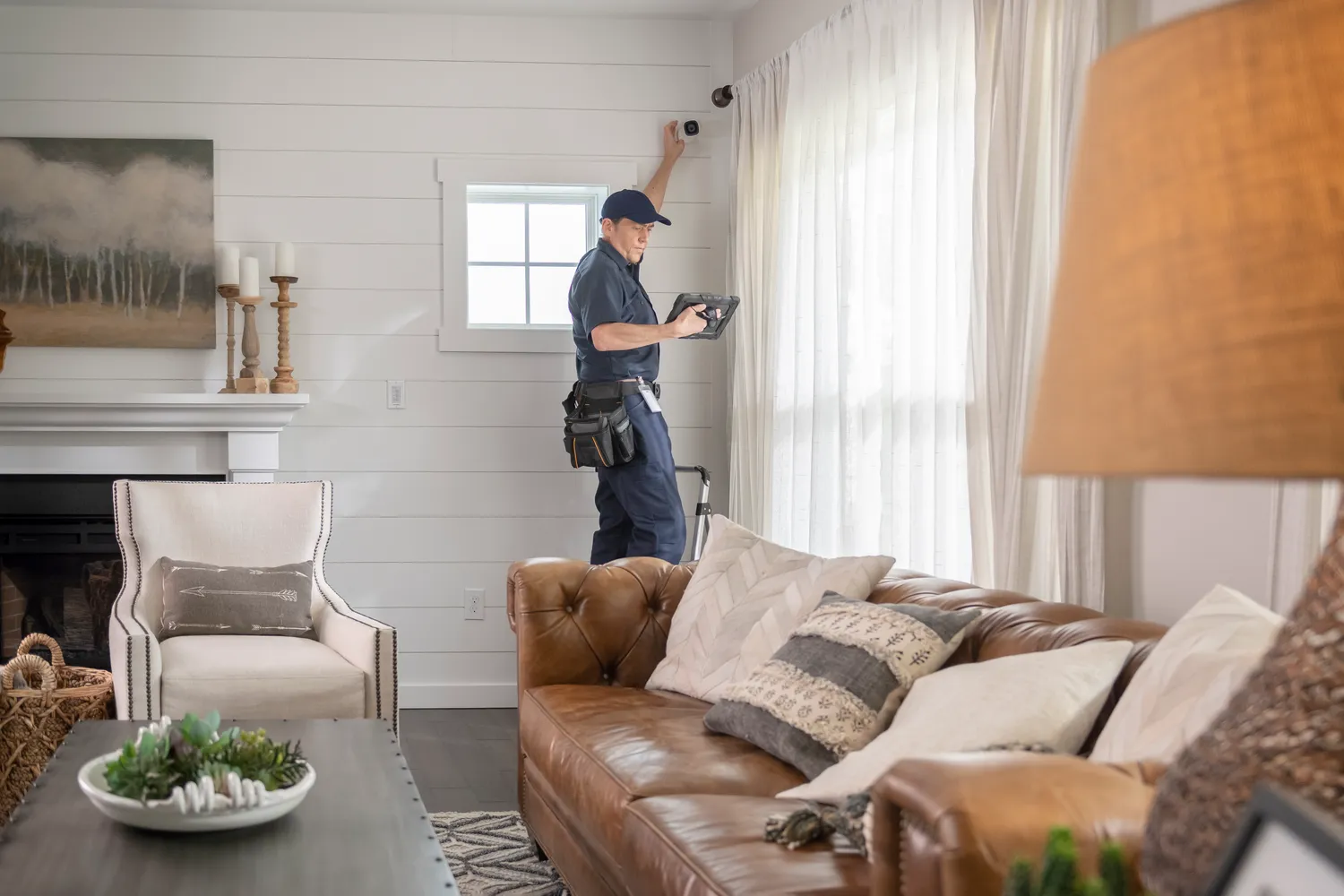 Technician installing HD security camera for CCTV system – RedFlag Security Ottawa